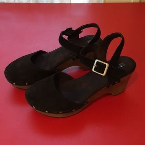 Black suede Mary Jane clogs.